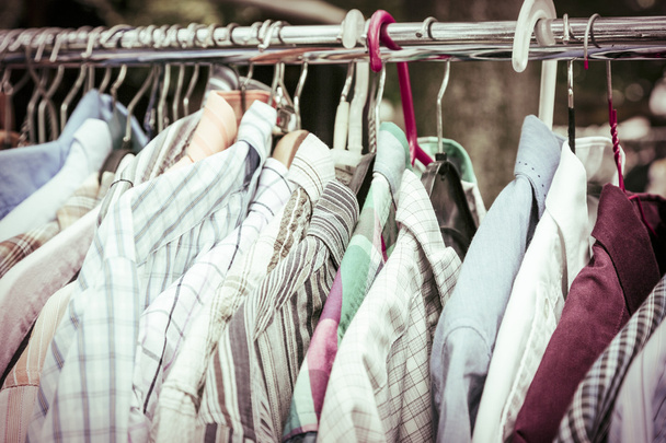 clothes on a rack on a flea market - Photo, Image