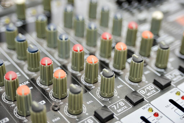 Multi-colored potentiometers on a mixing console, close-up. - Photo, Image
