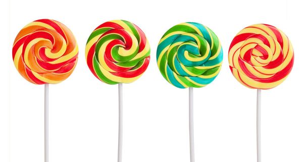 Multicolored candy on a stick on a white background - Фото, зображення