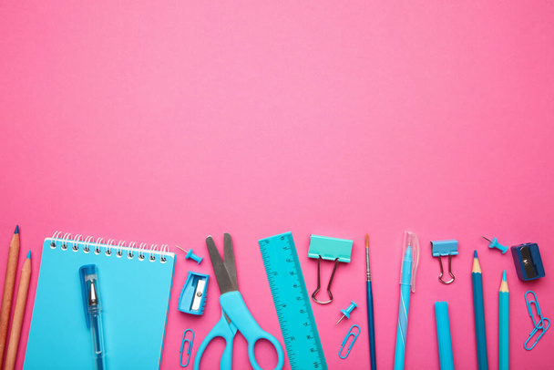 Blue school supplies on pink background. Back to school concept. Top view. - Foto, Imagem