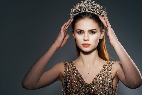 woman with crown on her head posing. High quality photo - Фото, изображение