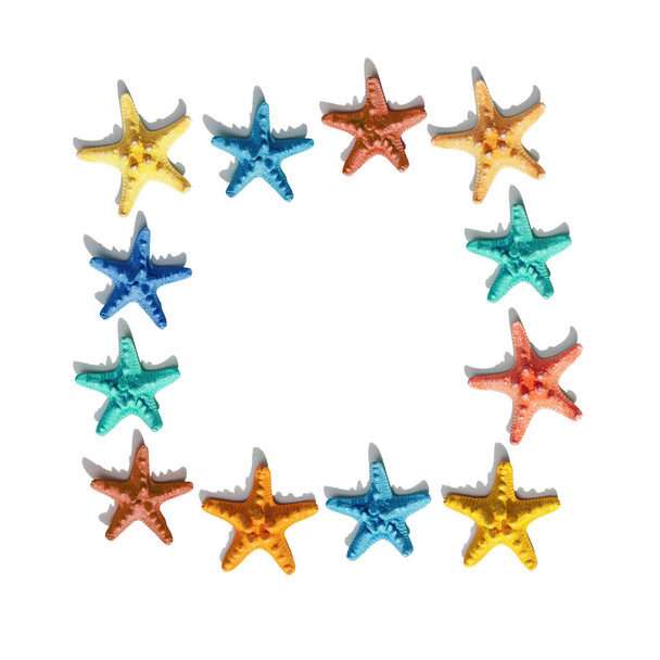 Square frame from colorful cute starfish on white background. Nautical or marine theme of sea life. Bright summer style. - Фото, изображение