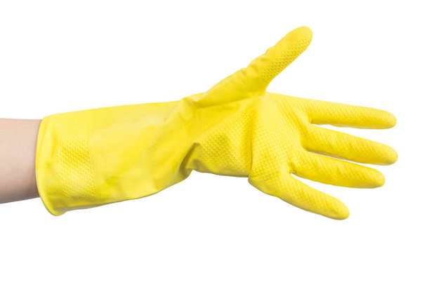 Kéz a sárga konyhában gumikesztyű, elszigetelt fehér háttér fotó - Fotó, kép