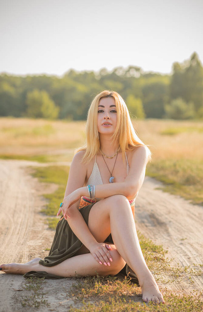 Vintage Boho style, girl in Hippie style at sunset, fashionable clothes and details. - Fotografie, Obrázek
