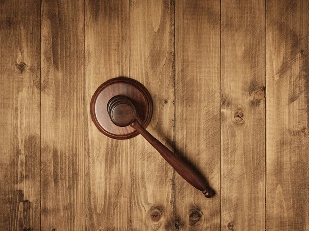wooden judge's gavel on wooden surface - Фото, изображение