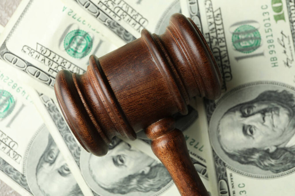 Judge gavel on dollar bills background, close up - Photo, Image