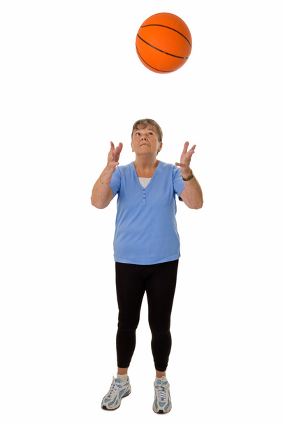Senior woman throwing basketball - Photo, image