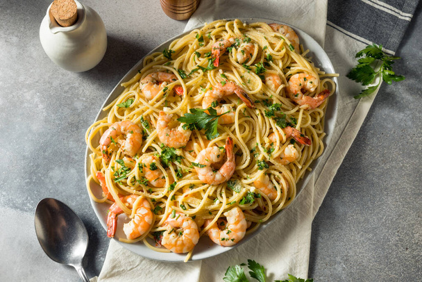 Homemade Cooked Shrimp Scampi with Pasta with Parsley - 写真・画像