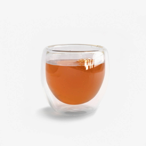 Honey in clear glass bowl isolated on white background. Sweet. Food. Honey bees. - Valokuva, kuva