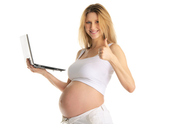 Happy pregnant woman with laptop isolated on white - Фото, зображення