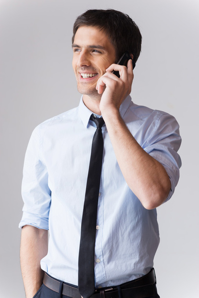 Man in shirt and tie talking on the mobile phone - Фото, изображение