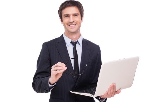 Man in formalwear holding laptop - Фото, зображення