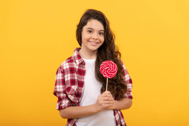 sweet tooth. yummy. happy girl hold lollipop. lollipop child. hipster kid hold lollypop. - Фото, изображение