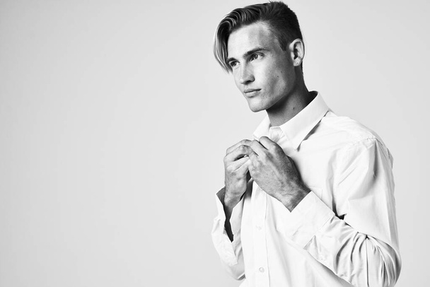 man in white shirt buttoning collar studio self confidence - Photo, Image