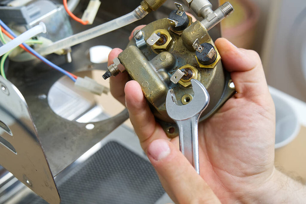 Repair of coffee machine. Spare parts for the espresso machine. Repair of kitchen appliances - Photo, Image