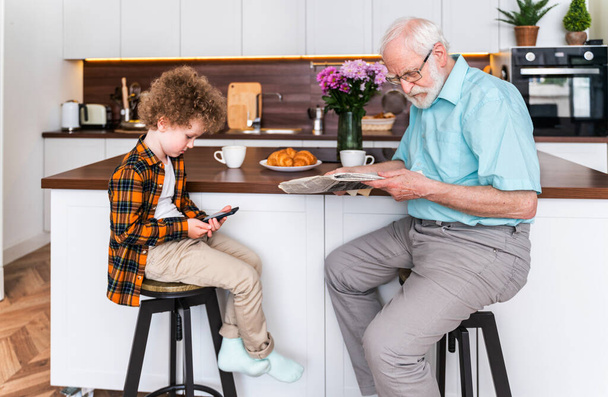 Grandparents and grandson playing at home - Family at home, grandfather taking care of nephew - 写真・画像