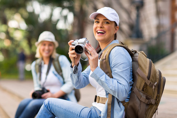 Cheerful tourist holding camera - Foto, imagen
