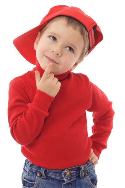 Niño sonriente con sombrero rojo pensando, aislado en blanco
 - Foto, Imagen