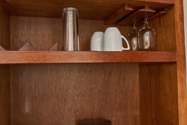 Wooden hotel room cupboard to put glasses and wine glasses - Photo, image
