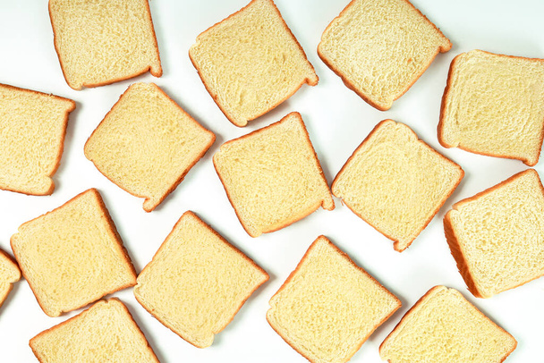 pattern of slices of bread on white background - 写真・画像