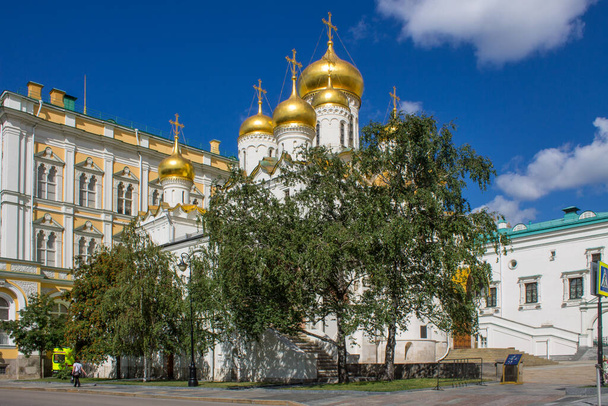 The Annunciation Cathedral in the Kremlin with golden domes shining in the sun on a clear summer day in Moscow Russia - Photo, image
