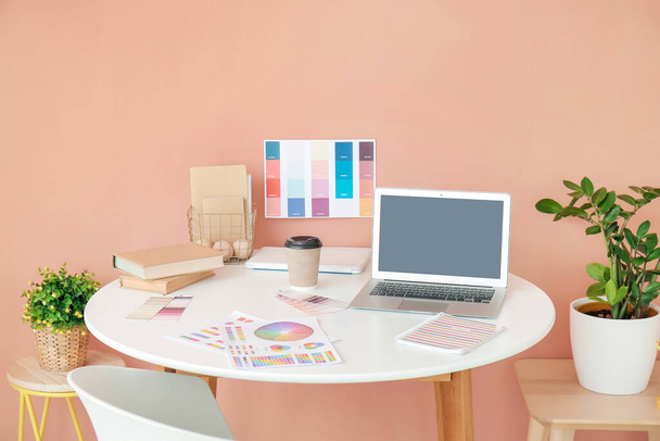 Stylish workplace of graphic designer with laptop in office - Photo, Image