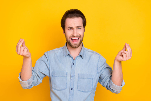 Photo portrait of young man arguing explaining showing italian sign isolated on vivid yellow color background - Fotó, kép