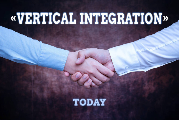 Text sign showing Vertical Integration. Business overview Merger of companies at different stages of production Two Professional Well-Dressed Corporate Businessmen Handshake Indoors - Photo, Image