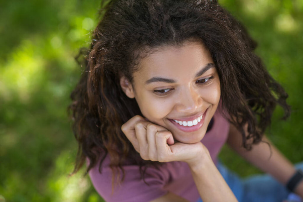 A cute dark-skinned young girl smiling nicely - Фото, зображення