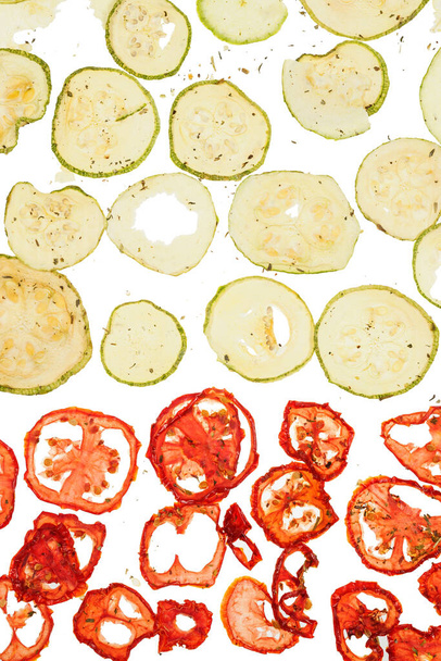 Dried tomato zucchini or courgette over white background - Fotó, kép