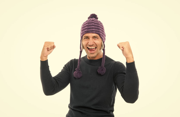happy mature man in winter warm knitted hat isolated on white, happiness - Fotó, kép