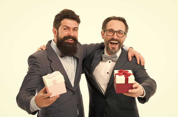 Prepared something special. Pick good present. Men classic suit hold gifts. Business people celebrate holiday. Corporate party concept. Hipster bearded bought gifts. Holiday shopping. Buy gifts - Foto, imagen