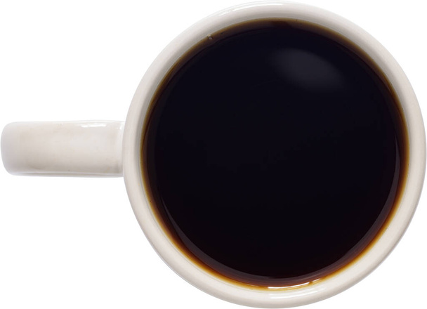 Κοντινό πλάνο ενός φλιτζανιού καφέ σε λευκό φόντο - Φωτογραφία, εικόνα