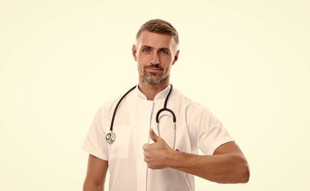 good quality service. best family doctor online. cleanliness and hygiene. man therapist use stethoscope. coronavirus pandemic outbreak. virus covid19. physician or nurse in hospital. medicine concept - Fotó, kép
