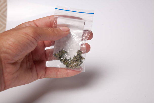 hand with pack of marijuana - Photo, image
