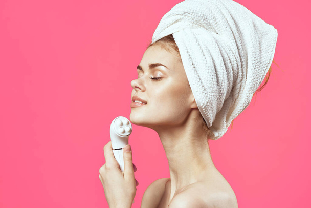 pretty woman  with naked shoulders cleaning her skin  - Photo, Image