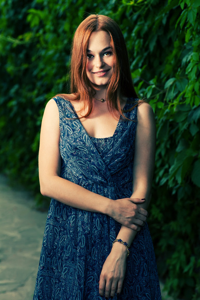 Red haired women smiling outdoors - Foto, Imagen
