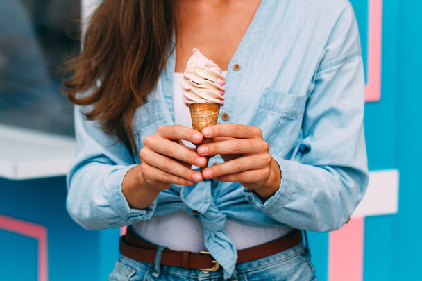 Woman eating sweet ice cream during a summer day - Foto, afbeelding
