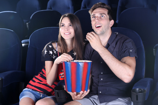 Young couple watching movie in cinema - Fotoğraf, Görsel