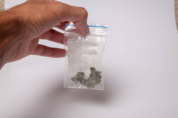 hand with pack of marijuana - Fotoğraf, Görsel