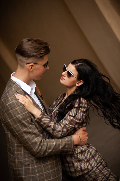 young couple in sunglasses on the street - Valokuva, kuva
