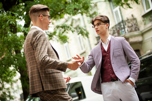 young men   on the street in  the city - 写真・画像