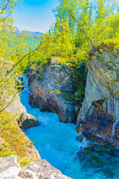 Fast flowing river water of the waterfall Rjukandefossen in Hemsedal Viken Norway. - Zdjęcie, obraz