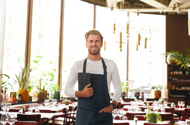 Portrait of restaurant owner smiling - Photo, Image
