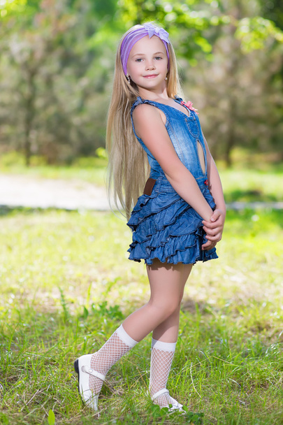 Little blond girl in jeans dress - Photo, Image