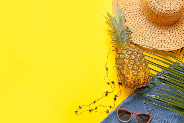 Set of female accessories with jeans and pineapple on color background, closeup - Photo, image