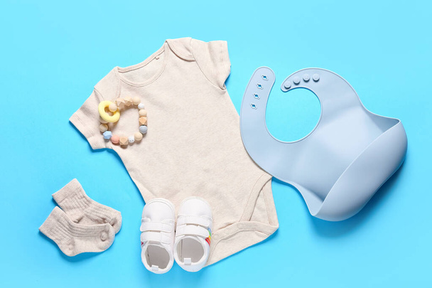 Baby clothes, shoes and accessories on color background - Photo, Image