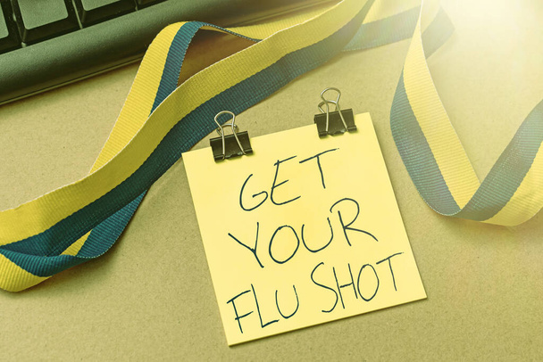 Conceptual caption Get Your Flu Shot. Business approach immunization is given yearly to protect against the influenza Multiple Assorted Collection Office Stationery Photo Placed Over Table - Foto, Imagen