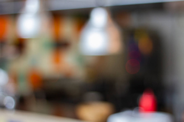 Blurred restaurant background with lights and bar counter - shallow DOF - Foto, Imagen