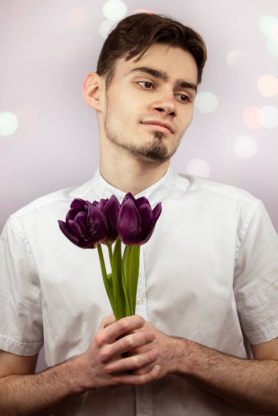 Guy with tulips - Фото, зображення